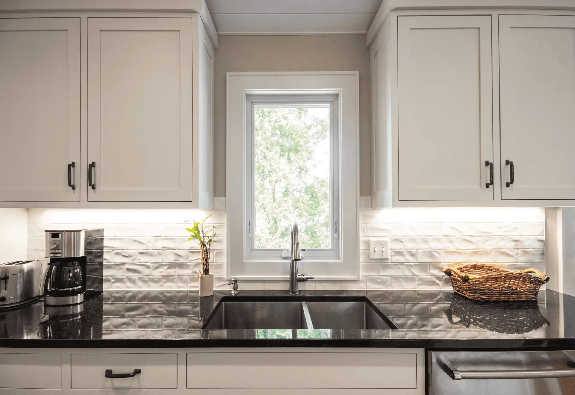 Interior kitchen image featuring an Awning window in Stone White interior finish.