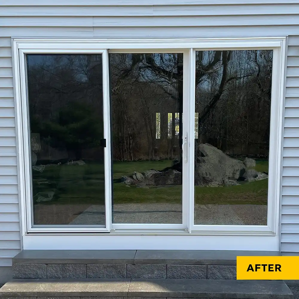 Completed installation of a three-panel Marvin Replacement sliding patio door.