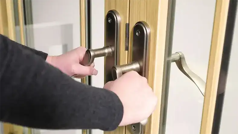 Man holds on to Marvin Replacement Inswing French door handles