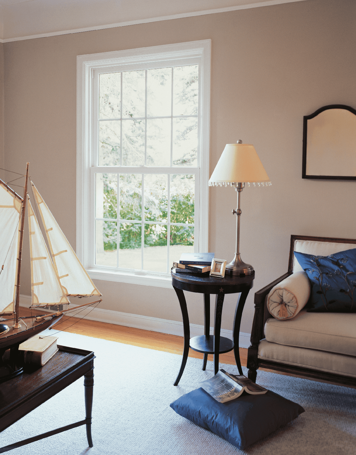 Interior living room image featuring Single Hung Window with Standard Simulated Divided Lites in Stone White interior finish with White hardware.