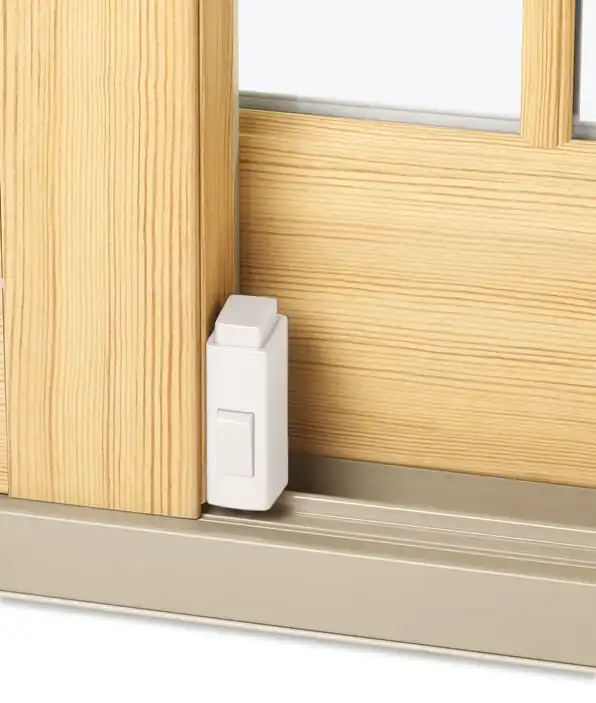 Marvin Replacement footbolt lock on a sliding glass door with Everwood finish and beige sill.