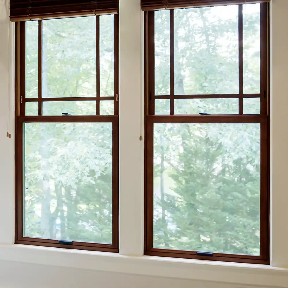 Interior view of Marvin Replacement double hung windows with EverWood finish and Prairie window grilles.