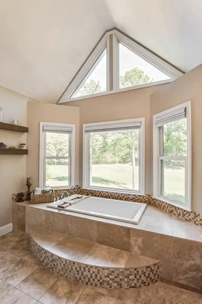 Interior view of a bathroom with Marvin Replacement special shape windows.