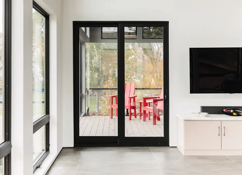 White home interior featuring a black Marvin Replacement Sliding French door during fall.