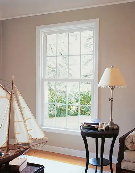 A Marvin Replacement Double Hung Window with Standard Simulated Divided Lites in Stone White finish.