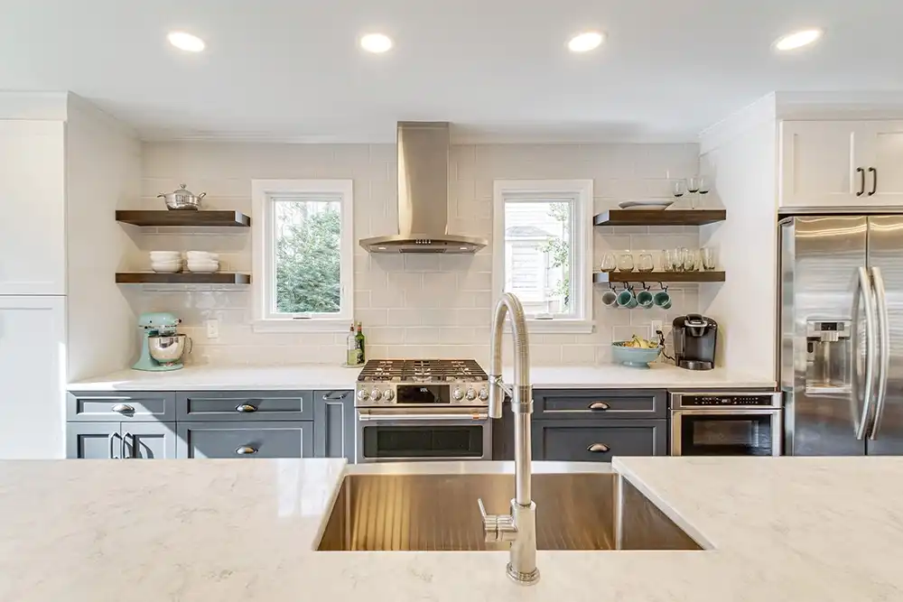 White kitchen interior featuring two white Marvin Replacement Casement windows