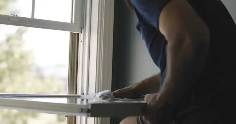 Man removes Marvin Replacement window