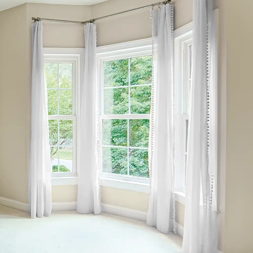 Interior view of three white Marvin Replacement single hung windows.