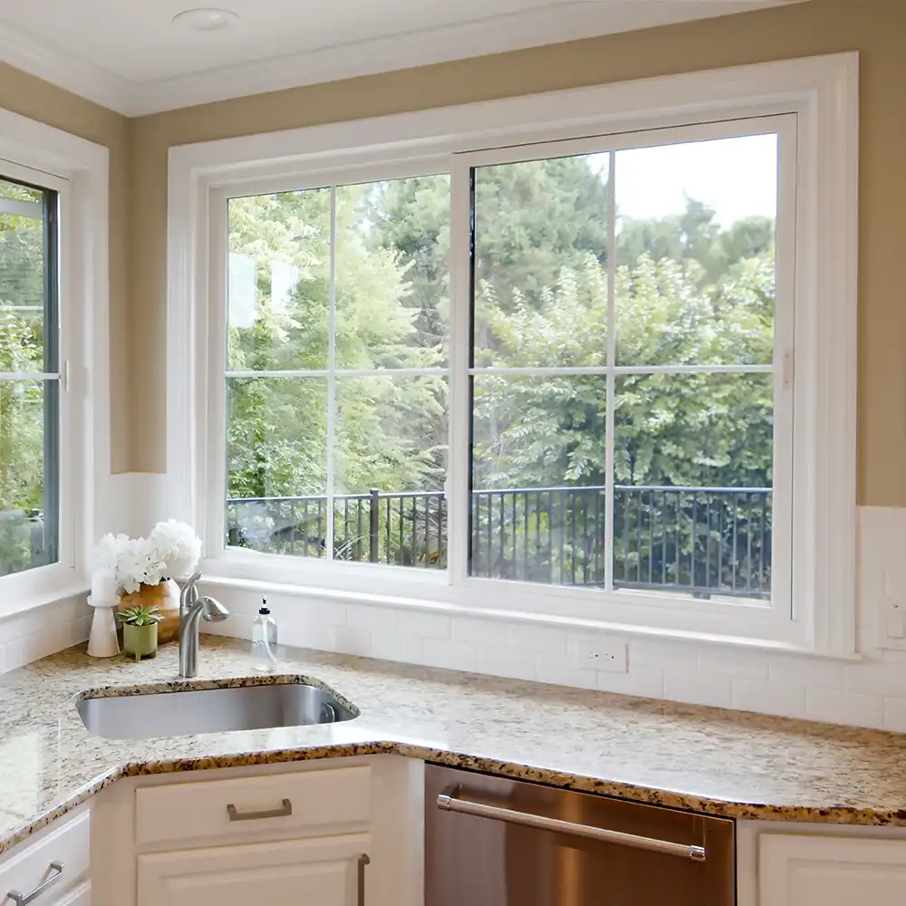 Interior view of a white Marvin Replacement kitchen slider window with grilles.